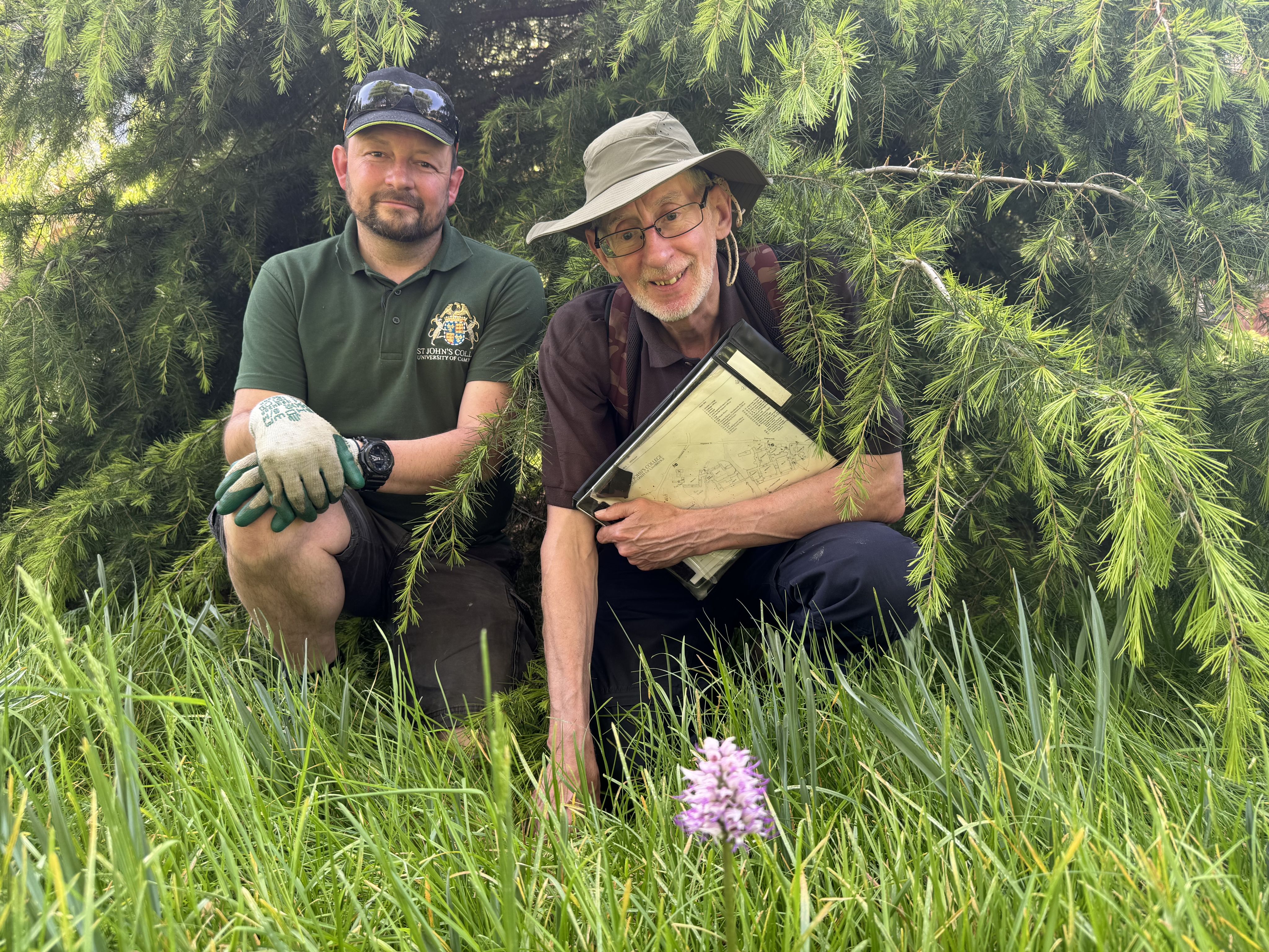 David Brown (left) and Jonathan Shanklin with the orchid