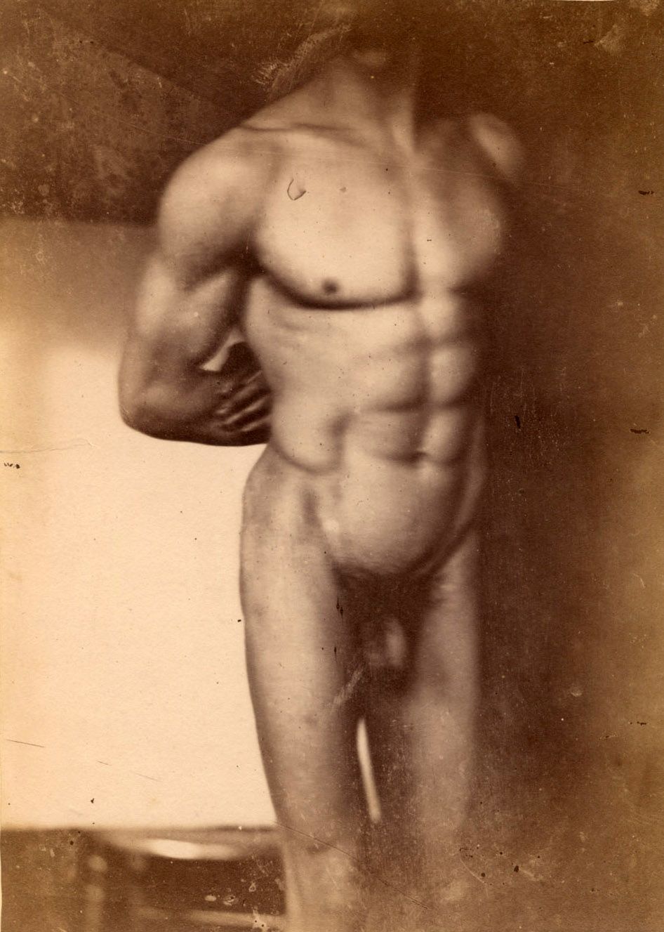 Photographic portrait of a nude male torso